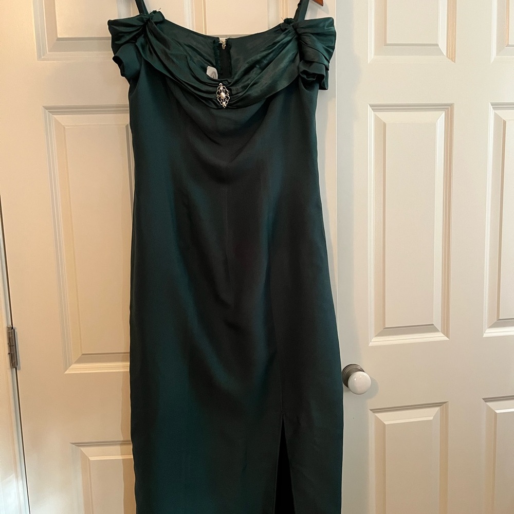 Green floor length, sleeveless, flattering lines. 100% acetate